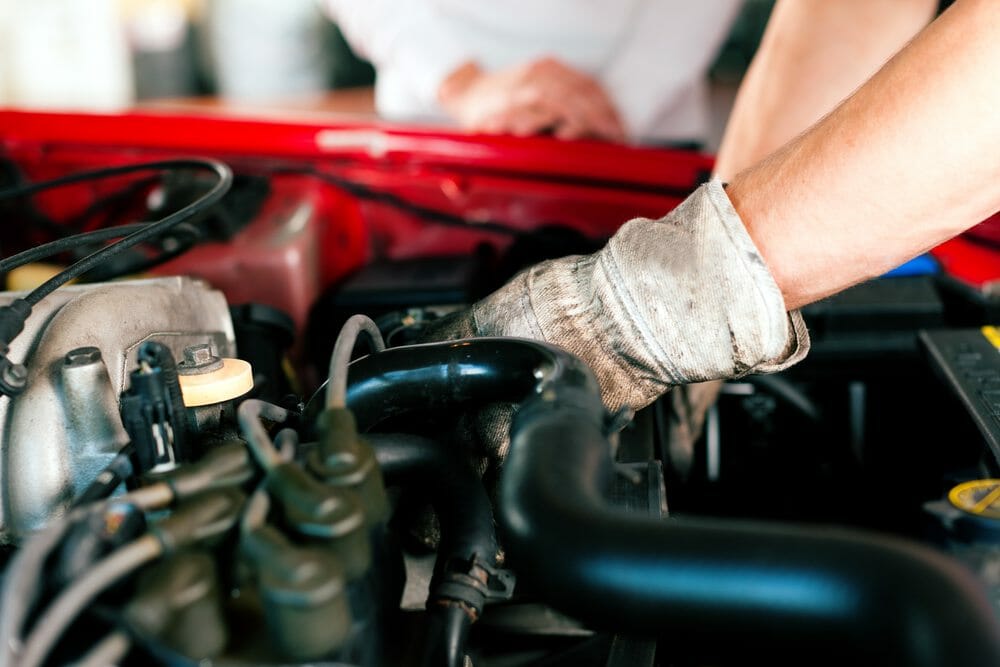 mechanic working on car providing auto maintenance services in anderson & milford, oh