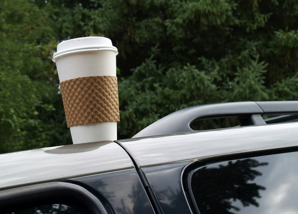 Coffee cup left on the top of a car